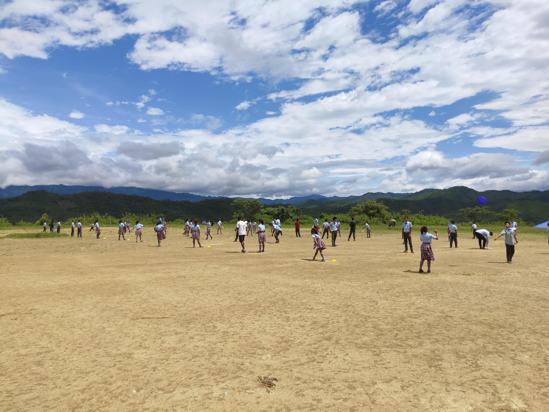 Children practicing throws at practice